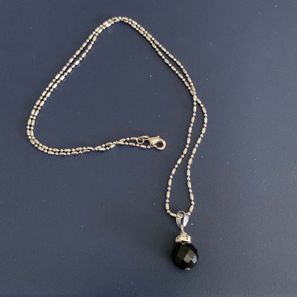 Silver necklace with black bead
